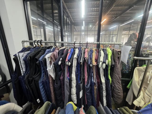 Racks of sample clothing inside the Dacotex showroom